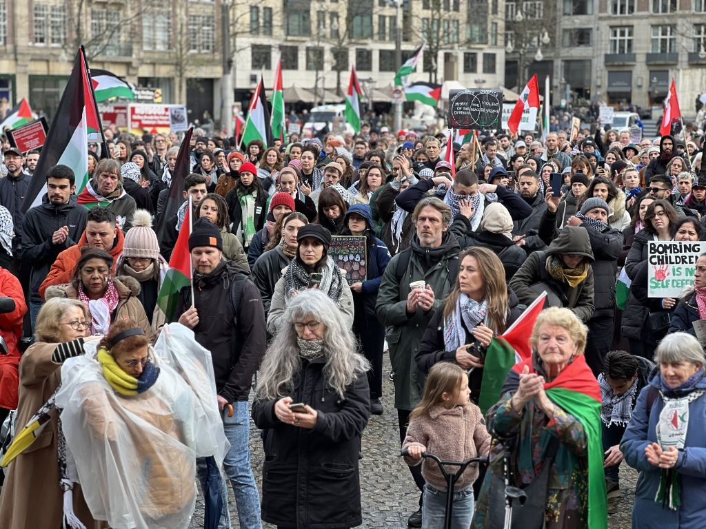 AMSTERDAM, NETHERLANDS - NOVEMBER 26: Demonstrators with banners gather at Dam Square and march to Museumplein (Museum Square) to call for a permanent ceasefire in Gaza during a rainy day in Amsterdam, Netherlands on November 26, 2023. (Photo by Selman Aksunger/Anadolu via Getty Images)