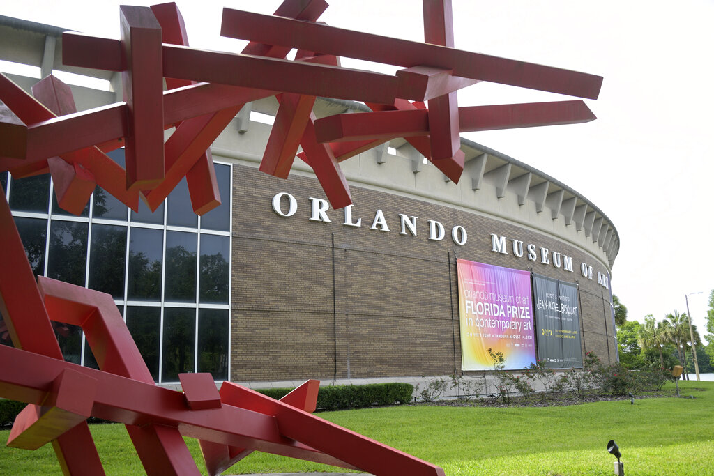 A sign outside the Orlando Museum of Art advertising an exhibition of art purported to be the work of artist Jean-Michel Basquiat is viewed, Thursday, June 9, 2022, in Orlando, Fla. (Phelan M. Ebenhack via AP)