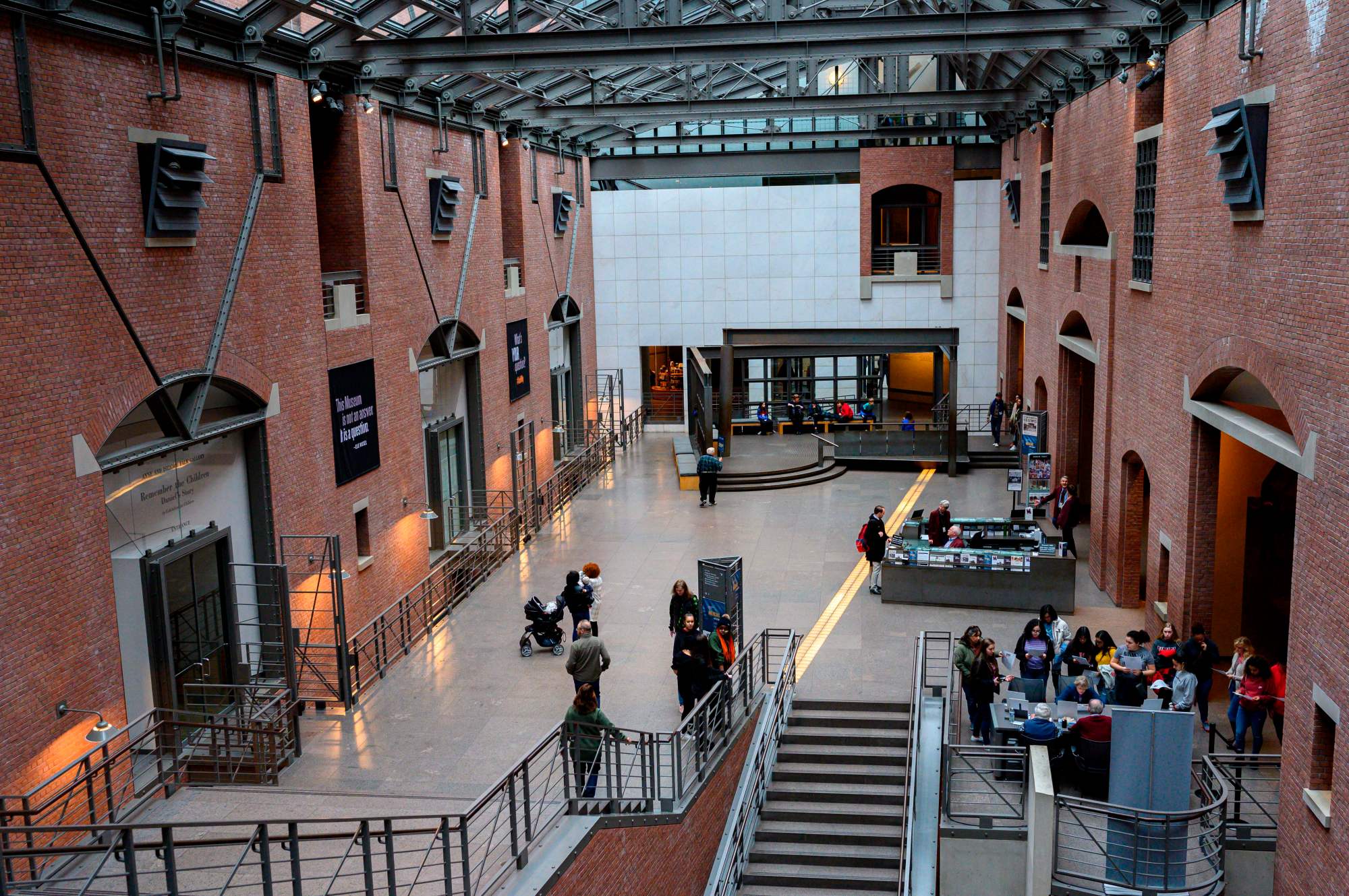 A museum atrium with people inside it.