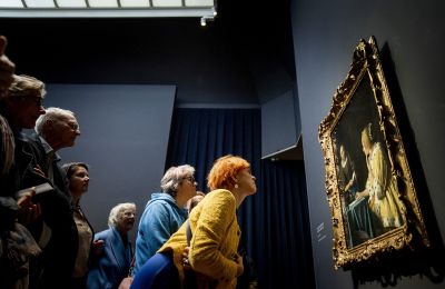 Visitors look at the painting "Mistress and Maid" during the opening of the Johannes Vermeer exhibition in the Rijksmuseum in Amsterdam February 9, 2023. - Guests from all over the Netherlands who have a link with the name Vermeer have been invited to the opening. The exhibition contains 28 of the 37 works Johannes Vermeer made.   - Netherlands OUT (Photo Koen van Weel / ANP / AFP) / Netherlands OUT (Photo by KOEN VAN WEEL/ANP/AFP via Getty Images)