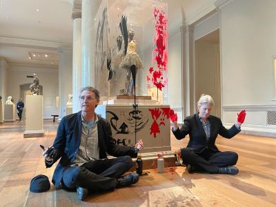 WASHINGTON, DC - APRIL 27: Climate protesters sitting in front of the artwork after smearing paint on the case that houses Edgar Degas's Little Dancer Aged Fourteen at the National Gallery of Art in Washington, D.C., Thursday, April 27, 2023. 
(Photo Ellie Silverman/The Washington Post via Getty Images)