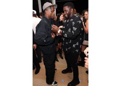 MIAMI BEACH, FLORIDA - DECEMBER 02: Sean "Diddy" Combs (R) attends as Travis Scott (L) and 50 Cent perform at Wayne & Cynthia Boich's Art Basel Party on December 02, 2022 in Miami Beach, Florida. (Photo by Alexander Tamargo/Getty Images)