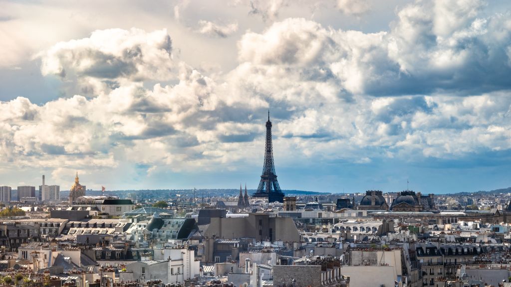 A view over rooftops in Paris, France, looking west from the Pompidou Centre towards The Eiffel Tower, Gustave Eiffel's landmark wrought iron structure built in 1889. (Photo by: Andy Soloman/UCG/Universal Images Group via Getty Images)