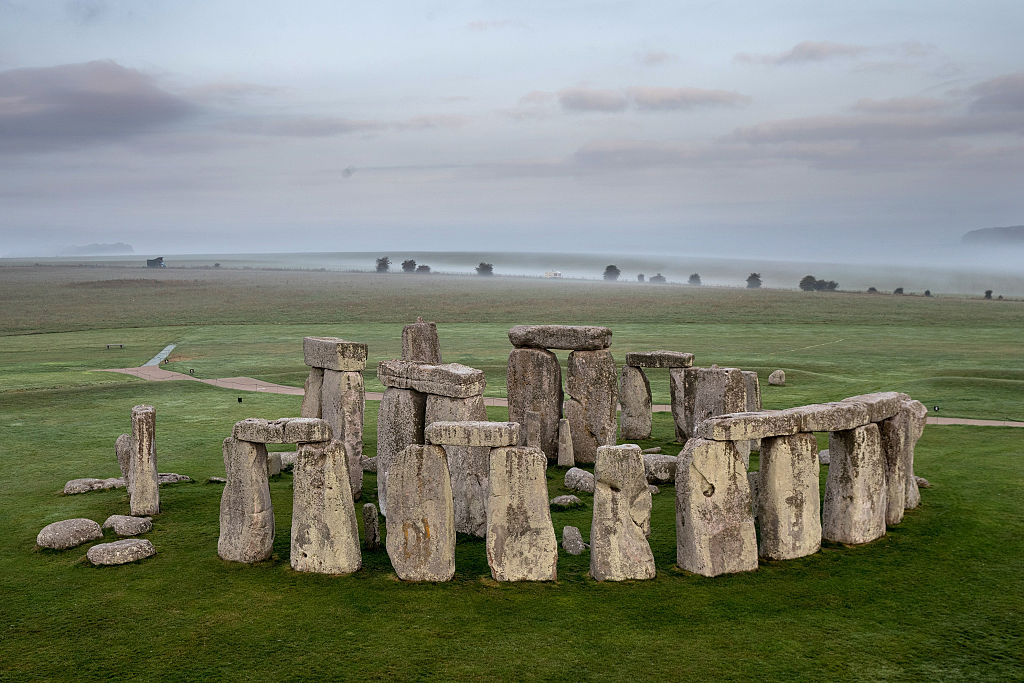The ancient neolithic monument of Stonehenge near Amesbury is viewed from a hot air balloon on September 7, 2016 in Wiltshire, England.  To mark the 30th anniversary of Stonehenge becoming a World Heritage Site, English Heritage has launched a competition offering members of the public the chance of a hot balloon ride which allows the chance to see a  unique view of Stonehenge within in a wider prehistoric landscape but also the see the recent changes to its setting in recent years including the removal of the A344 and the old car park.  (Photo by Matt Cardy/Getty Images)